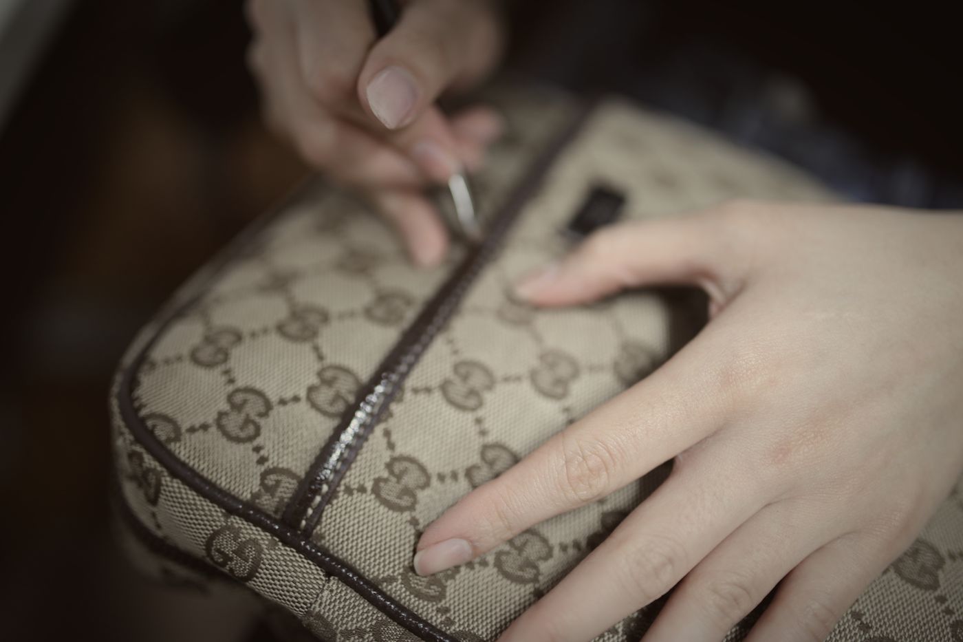 Repairing a Gucci bag edge